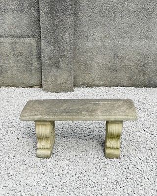 Lot 771 - A cast stone garden bench.