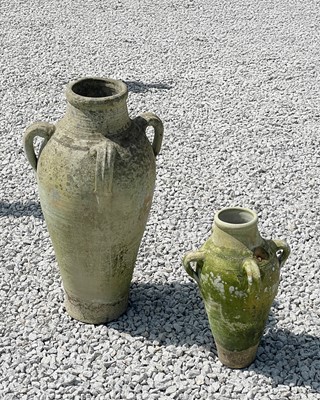 Lot 760 - Two weathered terracotta olive oil jars, each with four loop handles.