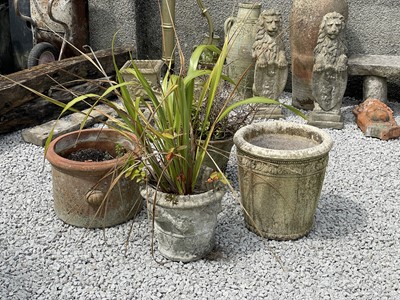 Lot 754 - A stone effect planter cast with classical masks and swags.