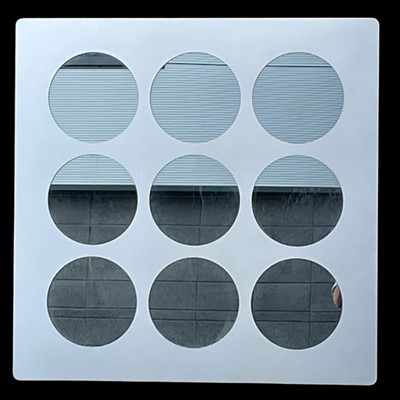 Lot 33 - A retro-style wall mirror with a stainless...
