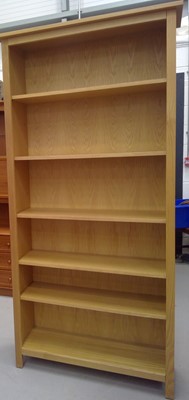 Lot 14 - A Blonde Oak Bookcase. The Bookcase is 200cm...