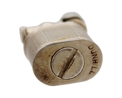 Lot 10 - DUNHILL - A 'Baby Sylph' silver-plated engine turned miniature lighter.