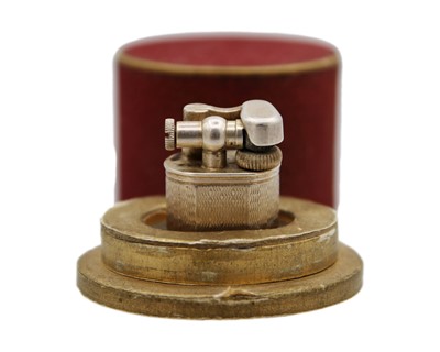 Lot 10 - DUNHILL - A 'Baby Sylph' silver-plated engine turned miniature lighter.