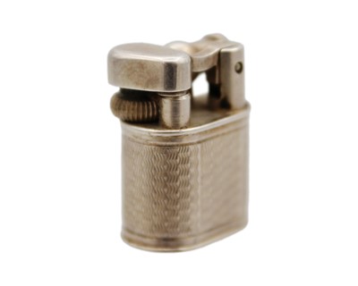 Lot 10 - DUNHILL - A 'Baby Sylph' silver-plated engine turned miniature lighter.