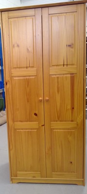 Lot 49 - A Modern Pine Wardrobe. The measurements are...