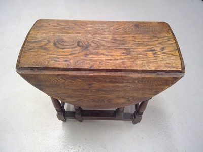 Lot 70 - An Oak Gate Leg Table. The Table is 73cm tall,...