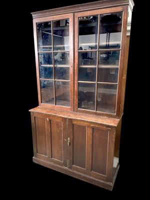 Lot 21 - A Mahogany Sideboard Bookcase. The piece is...