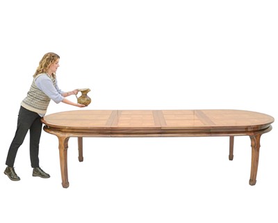 Lot 951 - An Eastern extending teak dining table.