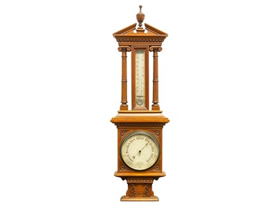 Lot 203 - A late Victorian walnut cased aneroid barometer.