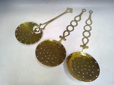 Lot 87 - Three Vintage Brass Cream Skimmers. 55cm long...