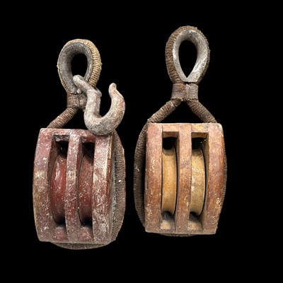 Lot 25 - Two marine double pulley blocks, one...