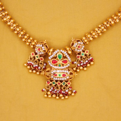 Lot 36 - A traditional Indian 22k gold, pearl with red and green paste fancy bead dholna necklace.
