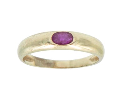 Lot 15 - An 18k gold with ruby band ring.