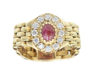 Lot 64 - A 14k gold ruby and CZ cluster chain ring.