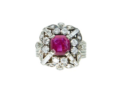 Lot 4 - A 9k white gold ruby and diamond dress ring.