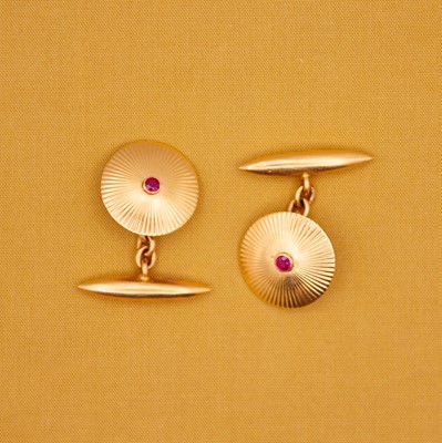 Lot 49 - A pair of high-purity gold ruby target-style cufflinks.