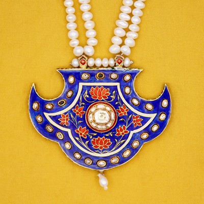 Lot 37 - A traditional Indian high-purity gold, enamelled, diamond set pankhi pendant on a pearl necklace.