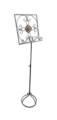 Lot 1 - An arts & crafts style wrought iron adjustable...