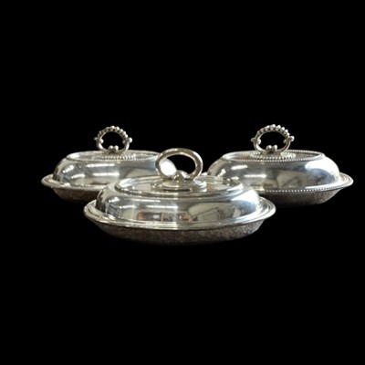 Lot 81 - Three silver-plated entrée dishes,30cm wide.