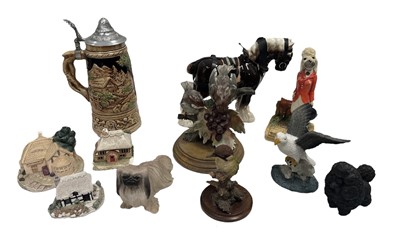 Lot 194 - A collection of ceramic and resin animal...