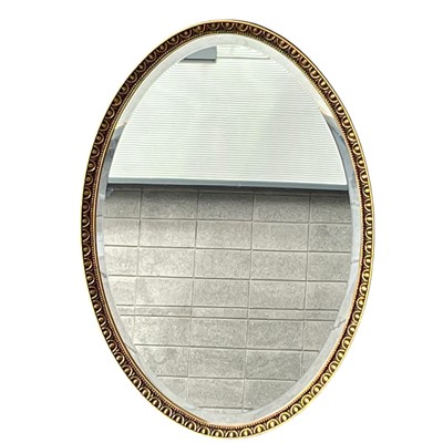 Lot 208 - An Oval Bevelled edge mirror in a Gilt frame....