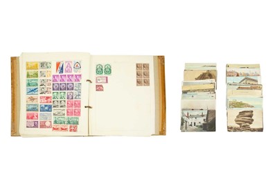 Lot 211 - A loose-leaf stamp album with a small...