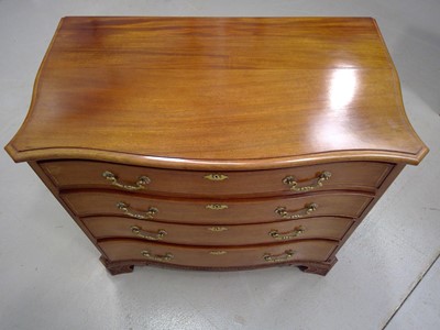 Lot 25 - A Bow Front Chest of Drawers. The Chest is...