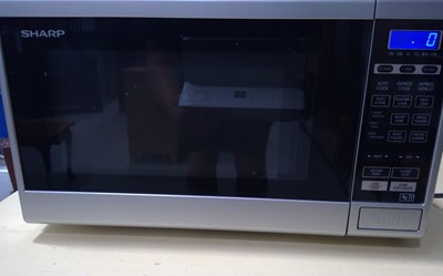 Lot 38 - A Sharp Microwave Oven. Model R-269(SL) M-A...