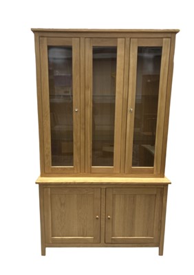 Lot 36 - A Blonde Oak Display Unit. The height is 199cm,...