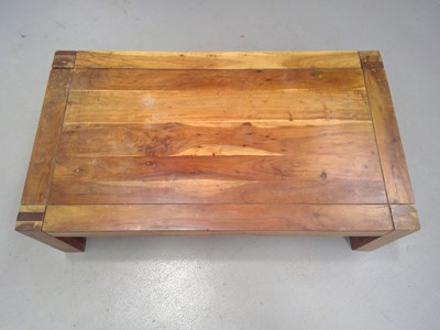 Lot 24 - A Sheesham Wood Coffee Table. The Table is...