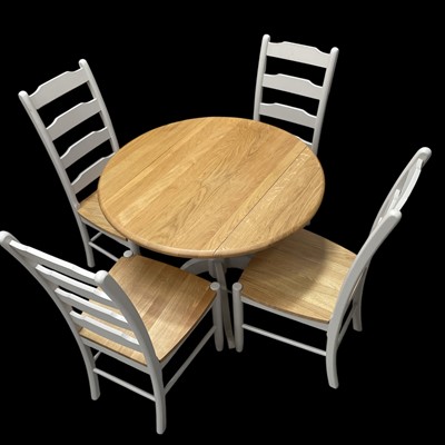 Lot 29 - A Folding Beech Table and Four Chairs. The...