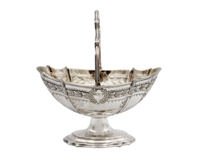 Lot 260 - An Edwardian swing handled pedestal lobed bonbon basket by Walker & Hall.