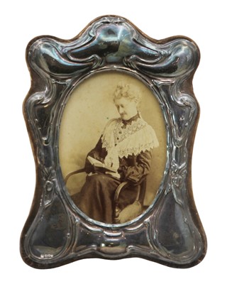 Lot 117 - A modern silver-mounted photograph frame in Victorian style.