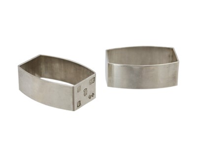 Lot 174 - A pair of modern silver napkin rings.