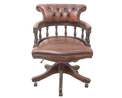 Lot 904 - A stained beech and leather captain's type office swivel chair.