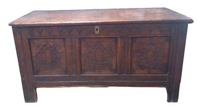 Lot 934 - An oak panel coffer.
