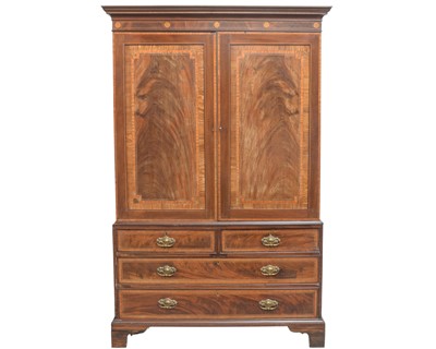 Lot 891 - A George III mahogany and satinwood banded linen press.