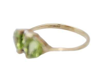 Lot 13 - A 9k gold peridot and diamond ring.