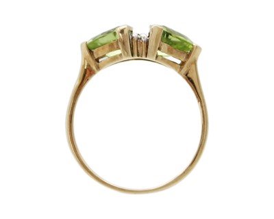 Lot 13 - A 9k gold peridot and diamond ring.