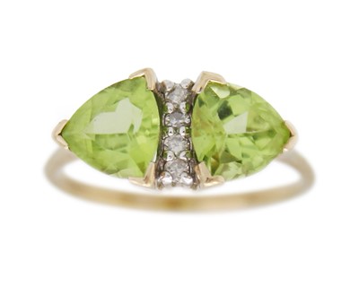 Lot 13 - A 9k gold peridot and diamond ring.
