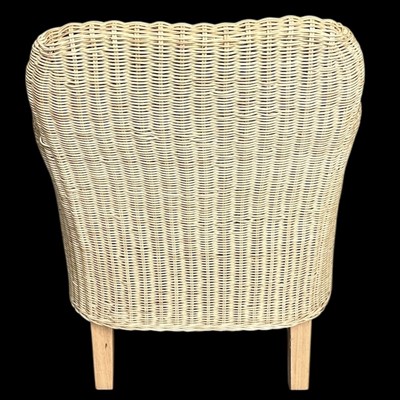 Lot 201 - A wicker chair with a loose cushion.