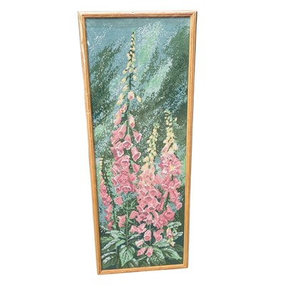Lot 208 - A framed cross-stitch panel depicting...