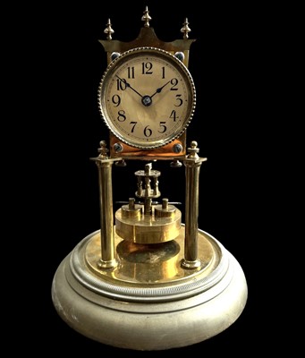 Lot 217 - A German-made torsion/anniversary clock, 28cm...