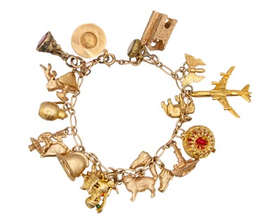 Lot 133 - A 9k gold charm bracelet applied with a good selection of 9k charms.