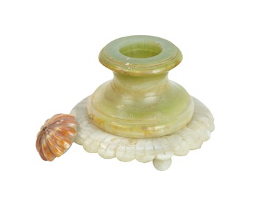 Lot 40 - A Mexican vari-coloured circular onyx inkwell.