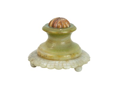 Lot 40 - A Mexican vari-coloured circular onyx inkwell.