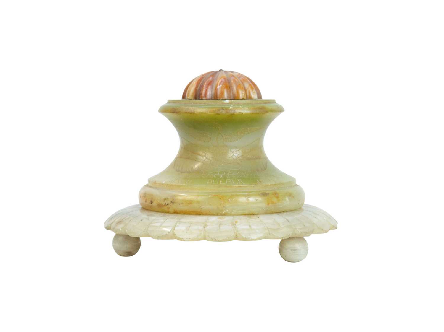 Lot 40 - A Mexican vari-coloured circular onyx inkwell.