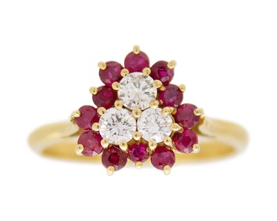 Lot 54 - A high-purity gold, ruby, and diamond trefoil cluster ring.