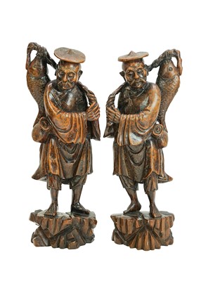Lot 393 - A pair of Chinese carved wood and silver inlay sculptures of fishermen.