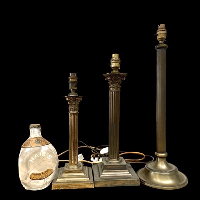 Lot 49 - Three column lamp bases, the largest being...